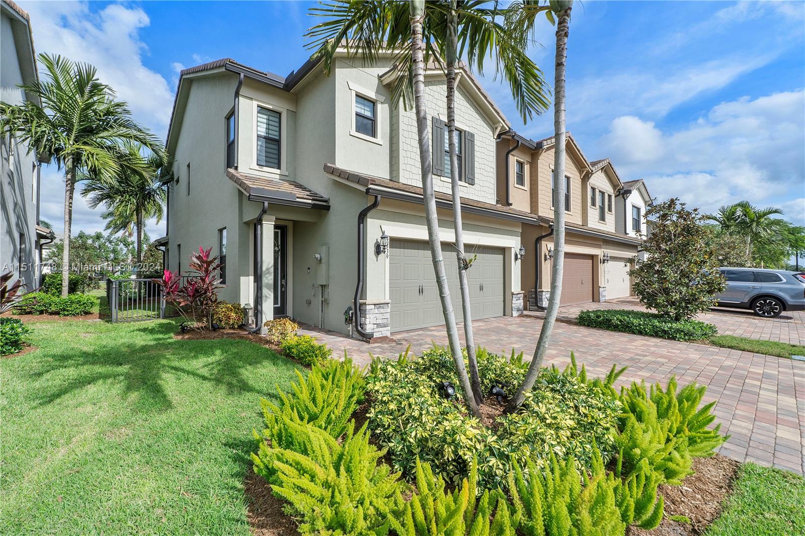 8339 Cadre Noir Road Lake Worth, FL 33467 - Photo 23 of 44 a front view of a house with a yard