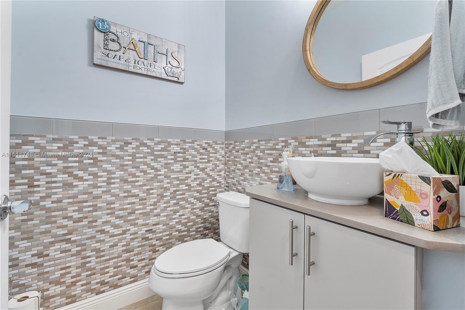 8339 Cadre Noir Road Lake Worth, FL 33467 - Photo 3 of 44 a bathroom with a toilet and a sink
