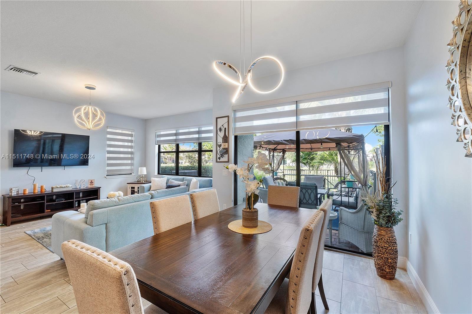 8339 Cadre Noir Road Lake Worth, FL 33467 - Photo 35 of 44 a view of a dining room with furniture window and outside view