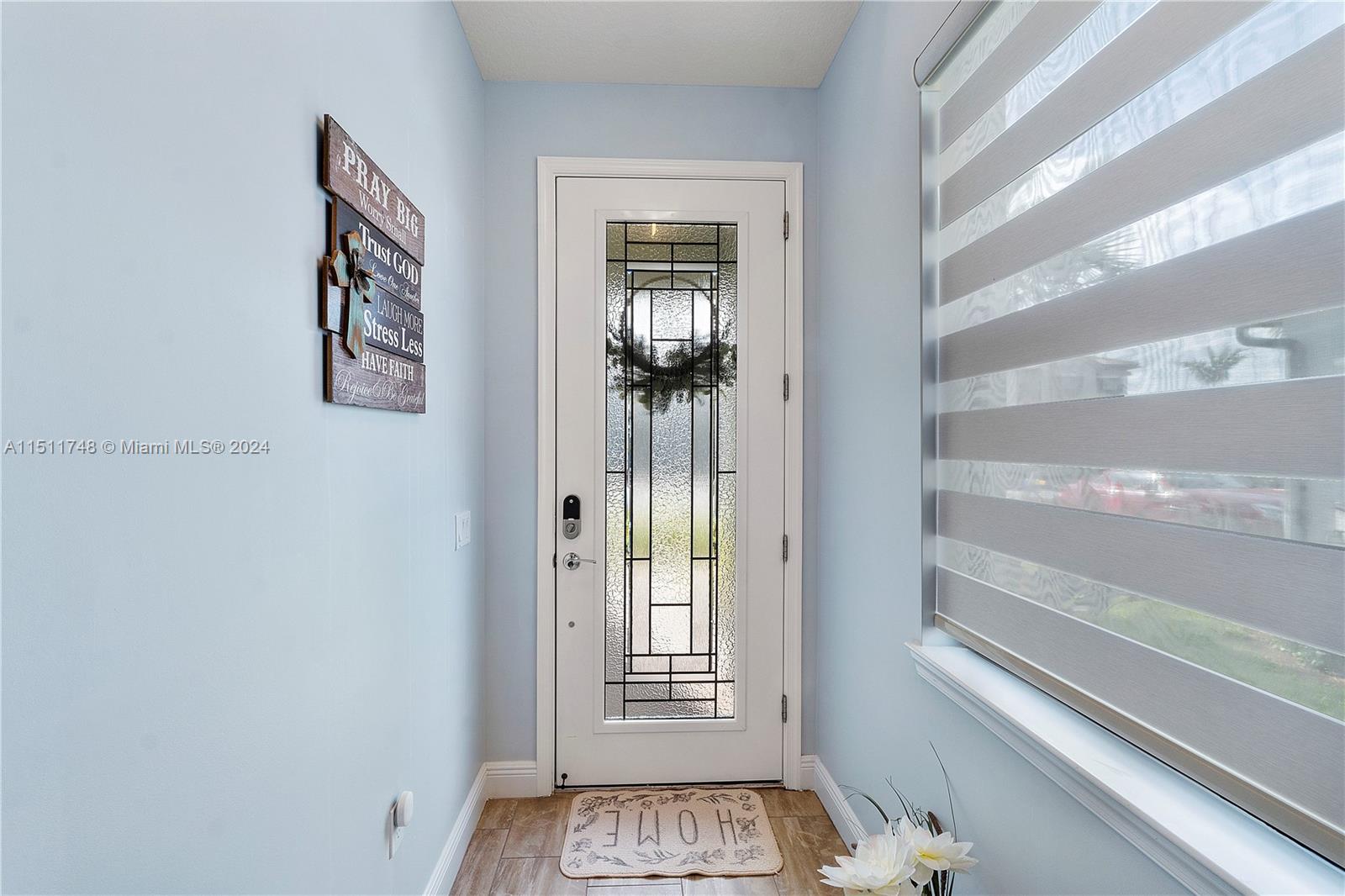 8339 Cadre Noir Road Lake Worth, FL 33467 - Photo 42 of 44 a view of a hallway with windows and stairs