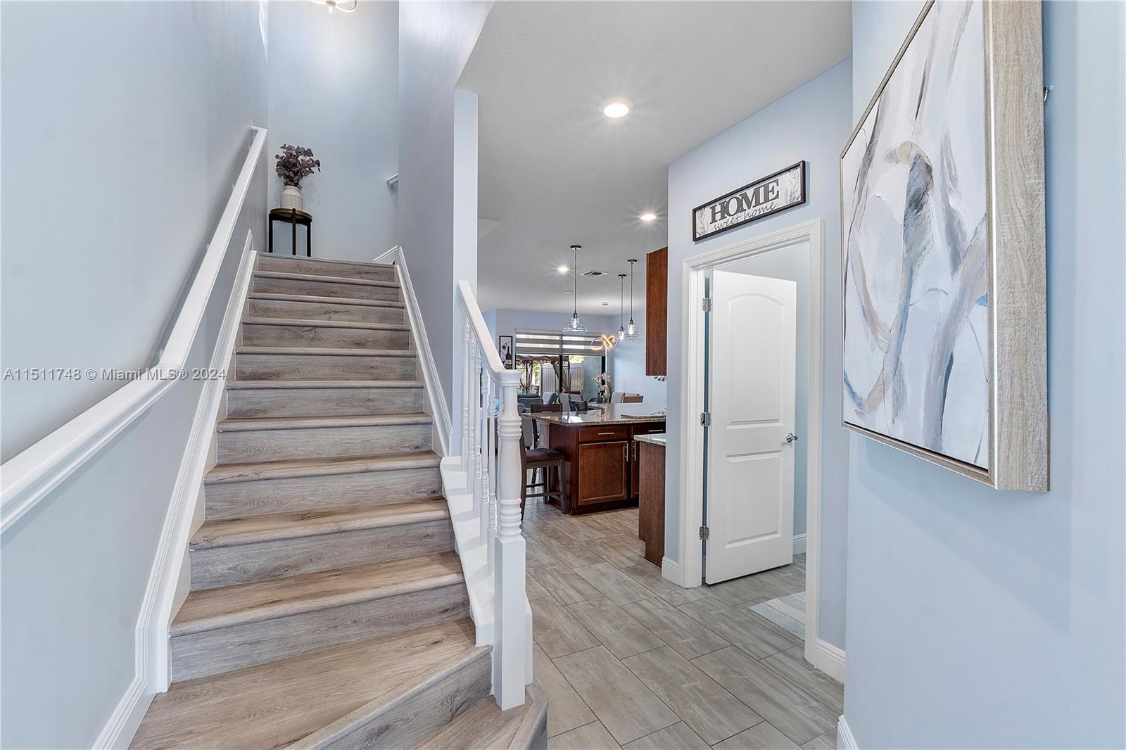 8339 Cadre Noir Road Lake Worth, FL 33467 - Photo 43 of 44 a view of entryway and hall with wooden floor