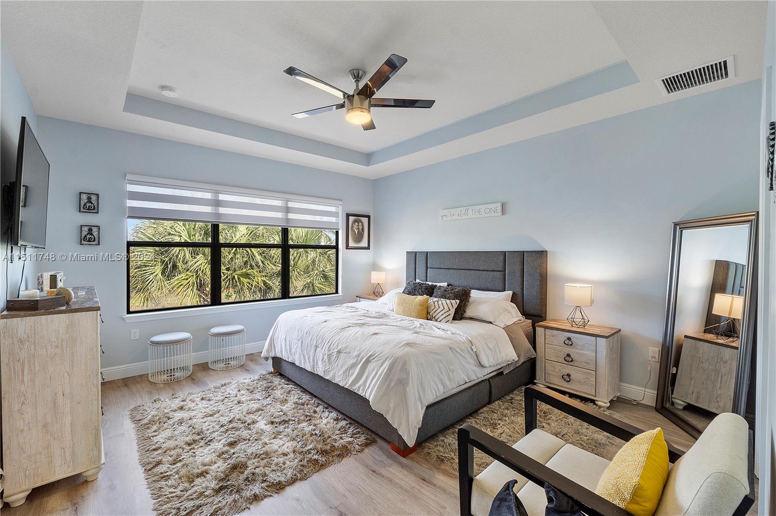8339 Cadre Noir Road Lake Worth, FL 33467 - Photo 6 of 44 a bedroom with a bed and window