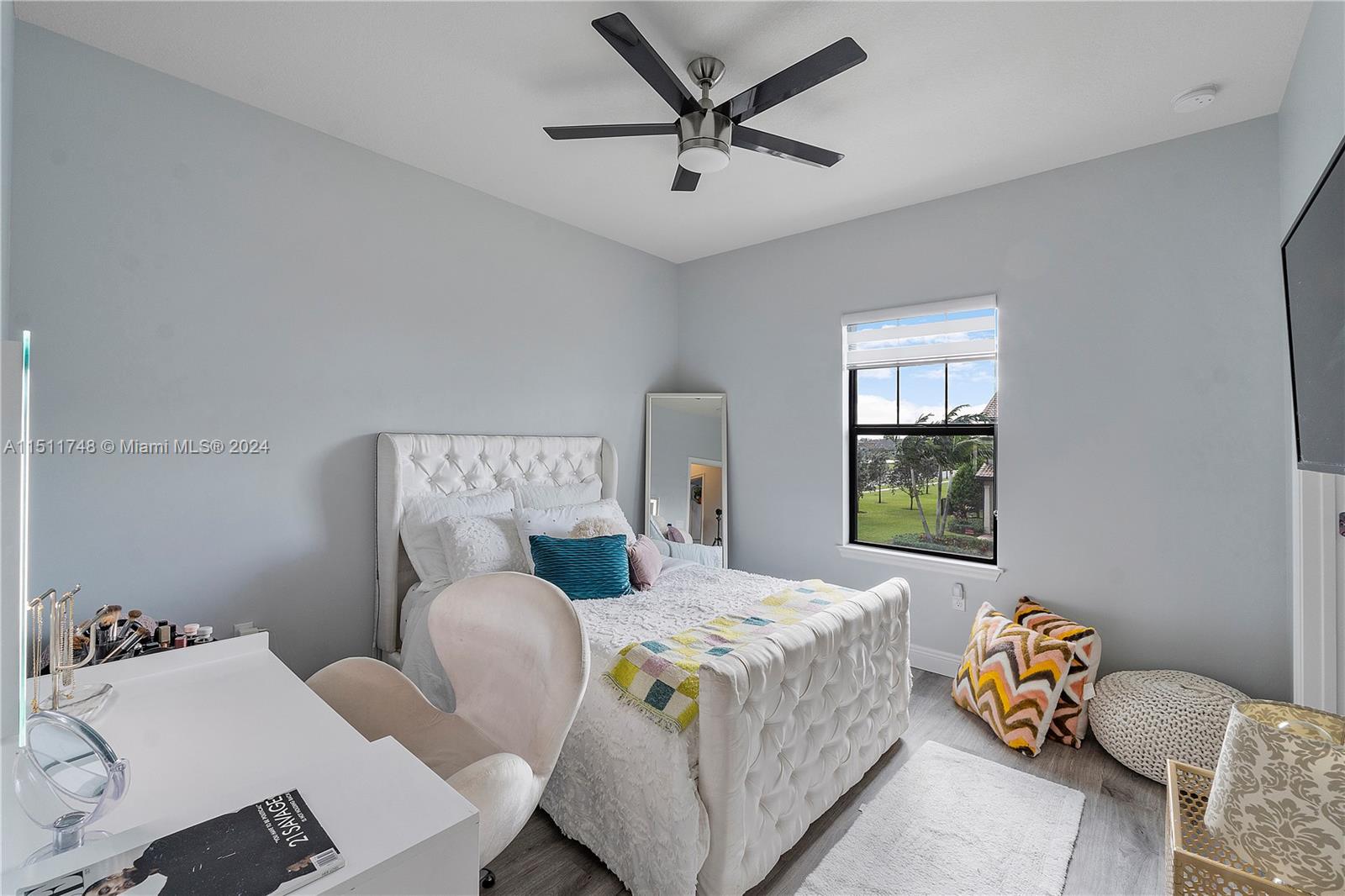 8339 Cadre Noir Road Lake Worth, FL 33467 - Photo 9 of 44 a bedroom with a bed furniture and a window