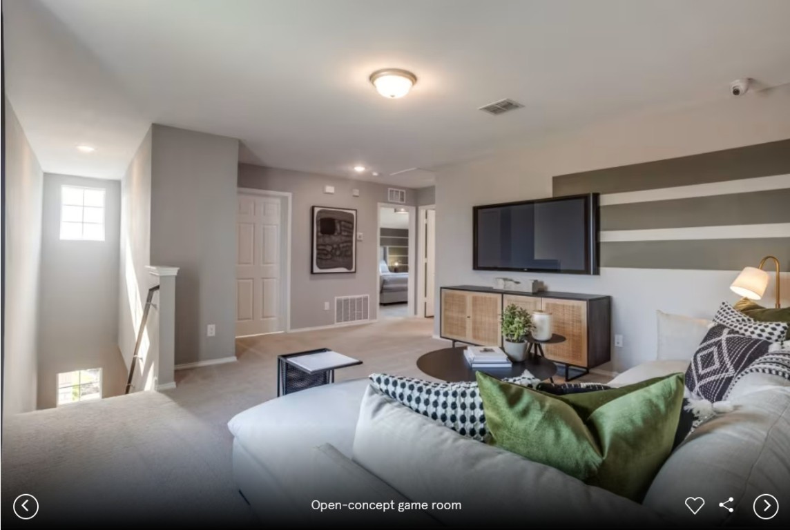 120 Golden Bell Way Buda, TX 78610 - Photo 6 of 10 a living room with furniture and a flat screen tv