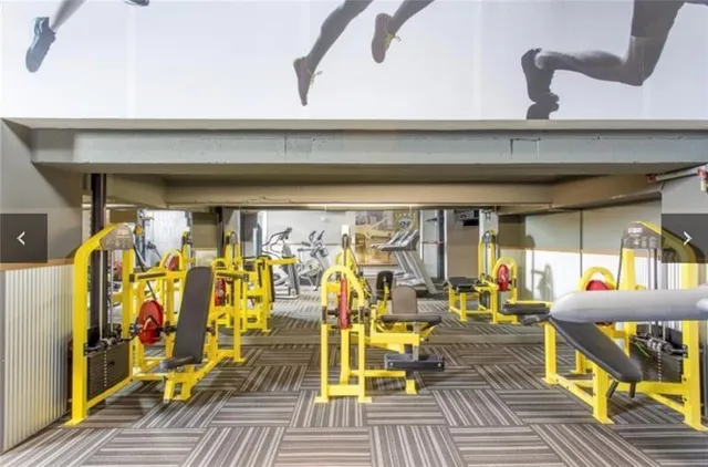 a living room with lots of furniture and a rug