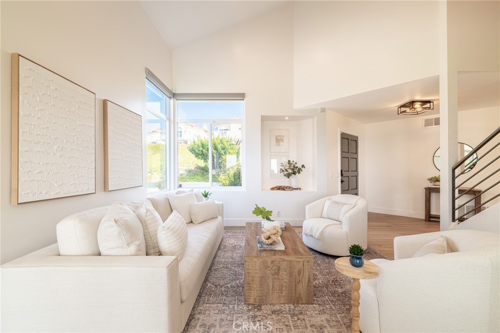27 Burriana San Clemente, CA 92672 - Photo 11 of 66 a living room with furniture and a large window