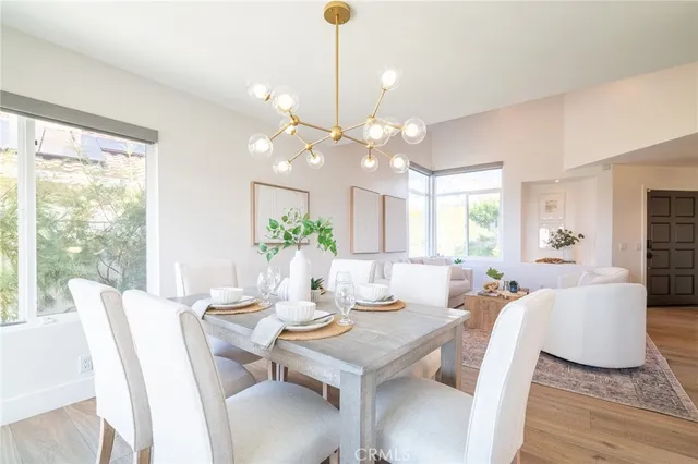 a kitchen with a refrigerator and white cabinets
