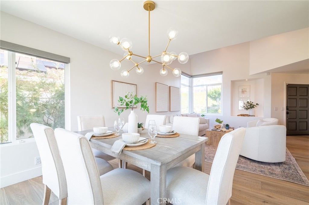 27 Burriana San Clemente, CA 92672 - Photo 19 of 66 a view of a dining room with furniture and wooden floor