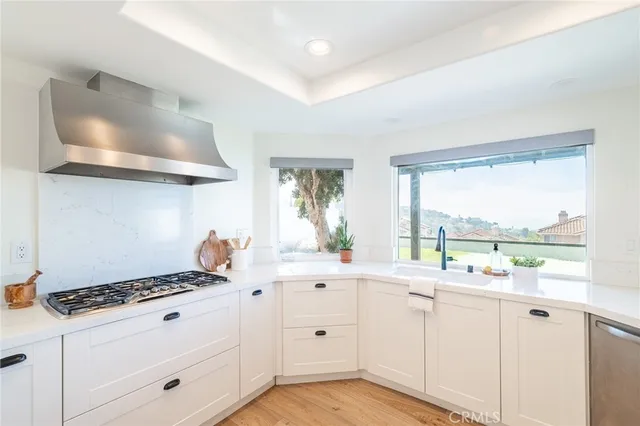 a view of a kitchen with wooden floor