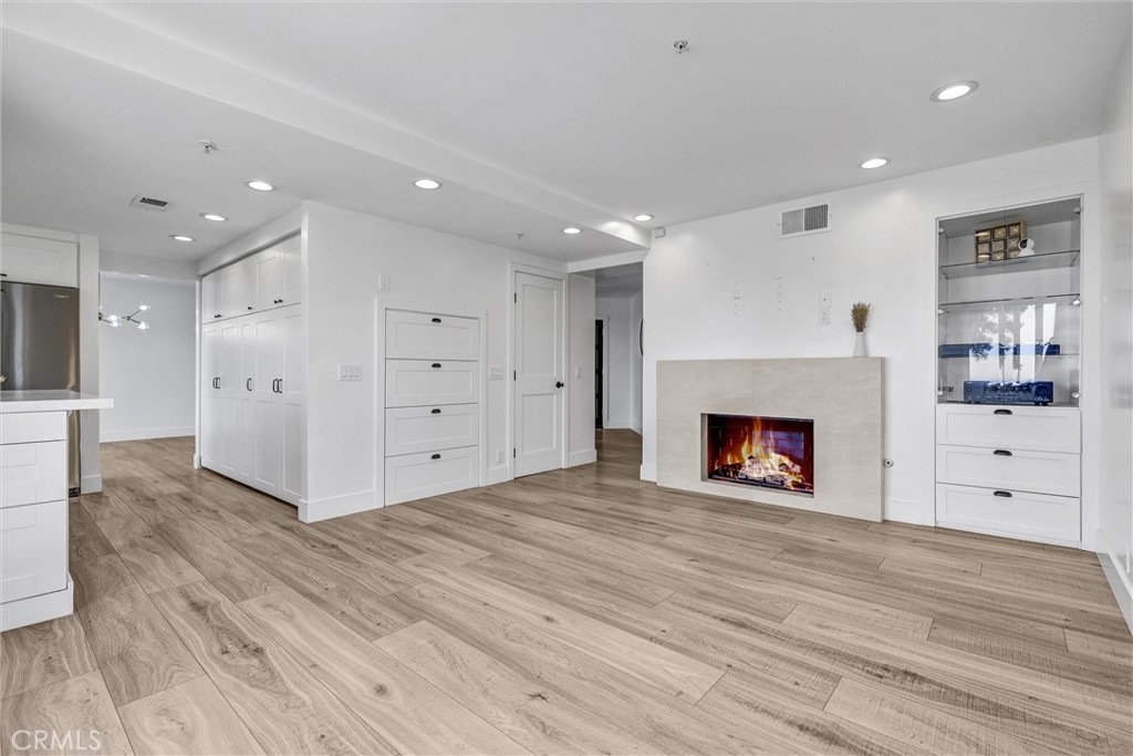 27 Burriana San Clemente, CA 92672 - Photo 25 of 66 a view of a kitchen with refrigerator and a fireplace