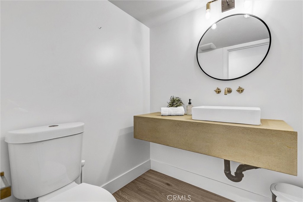 27 Burriana San Clemente, CA 92672 - Photo 27 of 66 a bathroom with a sink mirror vanity and toilet