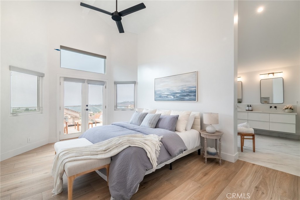 27 Burriana San Clemente, CA 92672 - Photo 29 of 66 a bedroom with a bed and a table