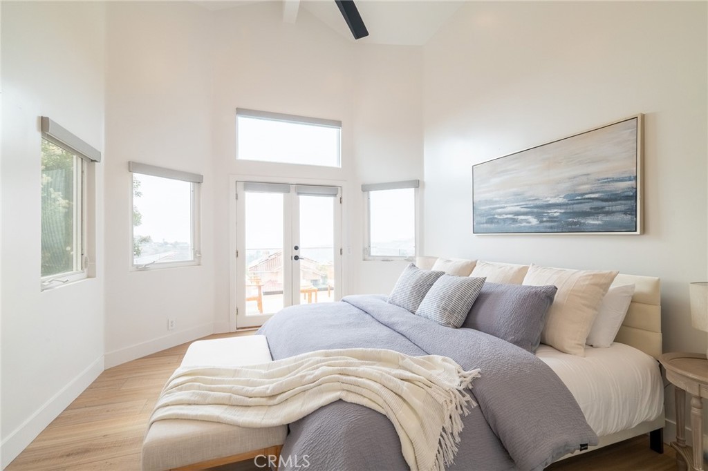 27 Burriana San Clemente, CA 92672 - Photo 33 of 66 a bedroom with a bed and wooden floor