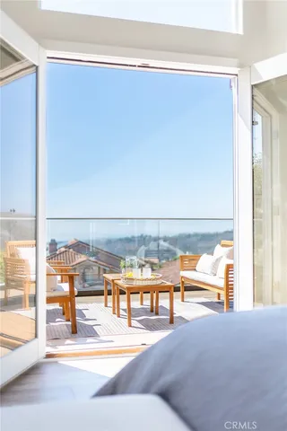 a spacious bedroom with a bed and a table