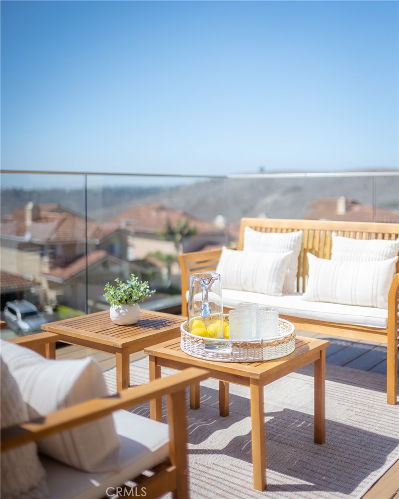 27 Burriana San Clemente, CA 92672 - Photo 38 of 66 a view of a swimming pool with a table and chairs