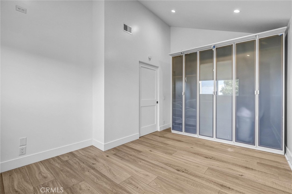 27 Burriana San Clemente, CA 92672 - Photo 47 of 66 a view of an empty room with wooden floor