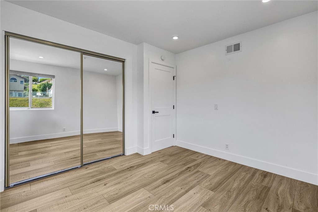27 Burriana San Clemente, CA 92672 - Photo 50 of 66 a view of empty room with wooden floor