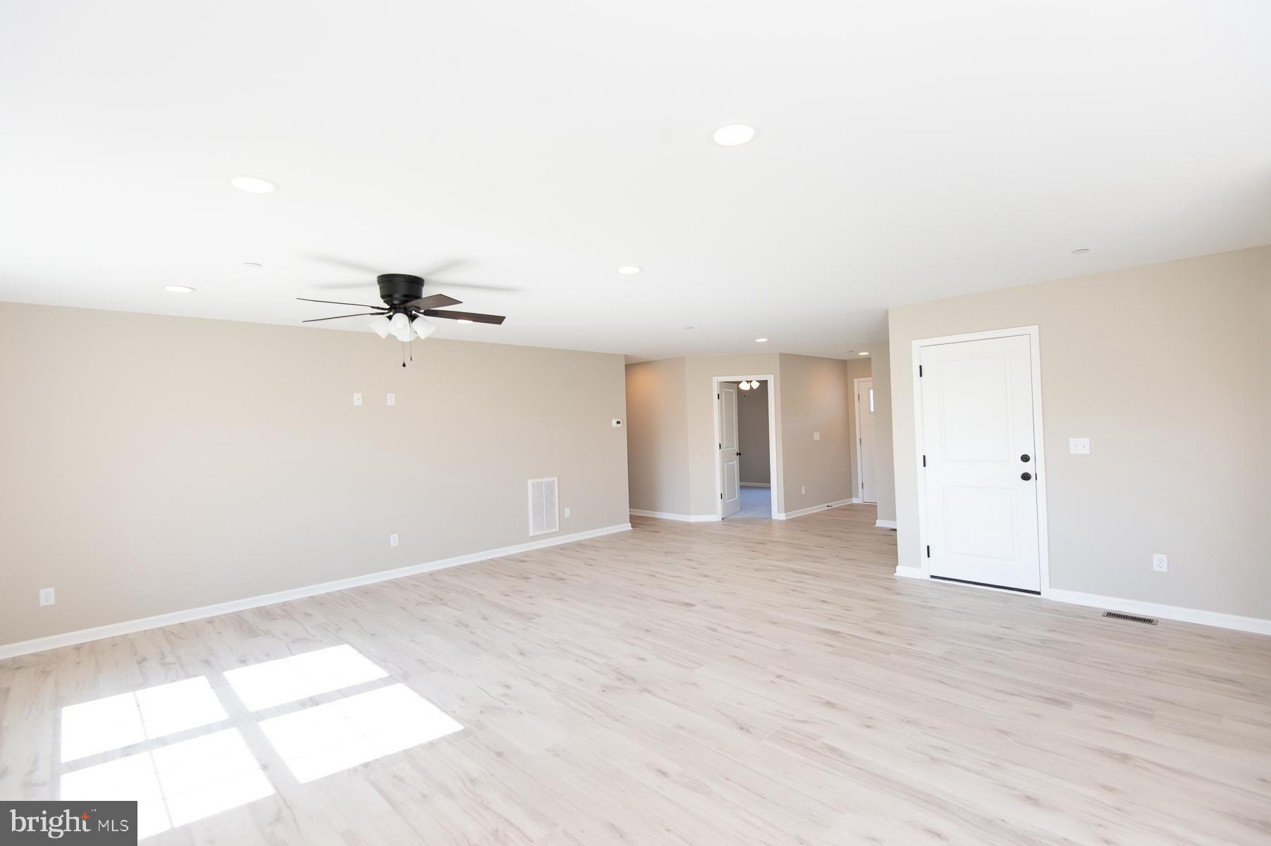 Wrights Rest Road Hurlock, MD 21643 - Photo 16 of 22 an empty room with a empty space and a ceiling fan