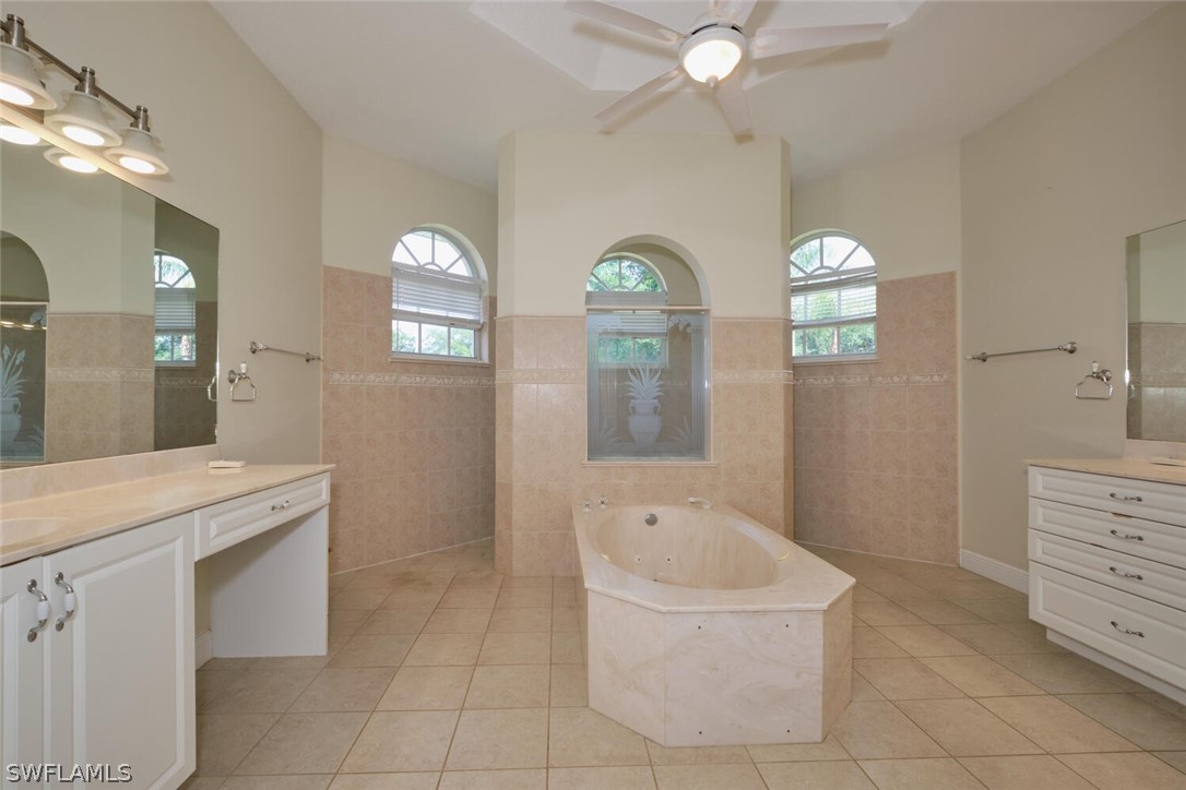2050 Balsey Road Alva, FL 33920 - Photo 16 of 35 a spacious bathroom with a tub sink and mirror