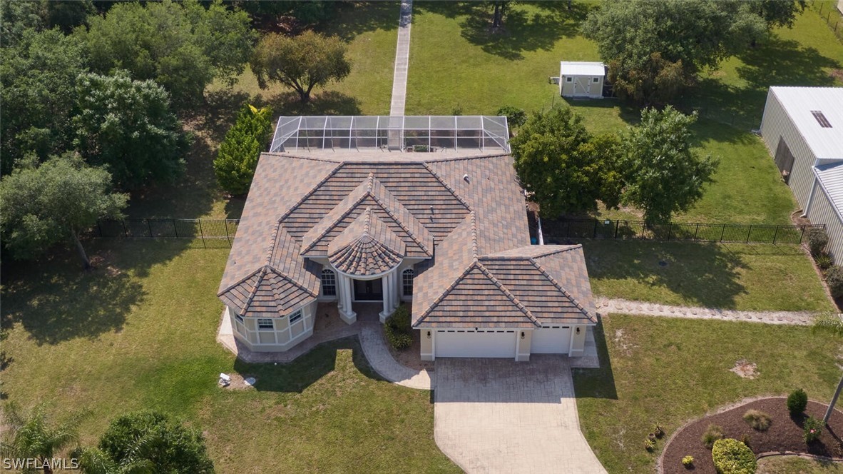 2050 Balsey Road Alva, FL 33920 - Photo 2 of 35 an aerial view of a house with swimming pool and outdoor seating