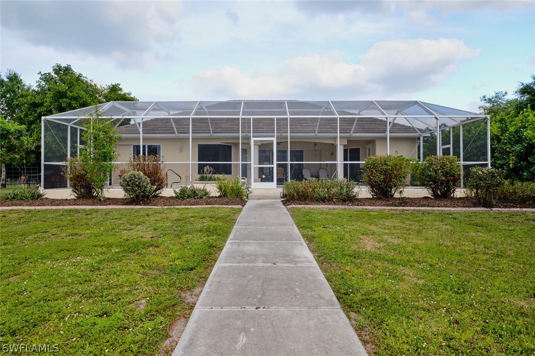2050 Balsey Road Alva, FL 33920 - Photo 25 of 35 a front view of a house with garden