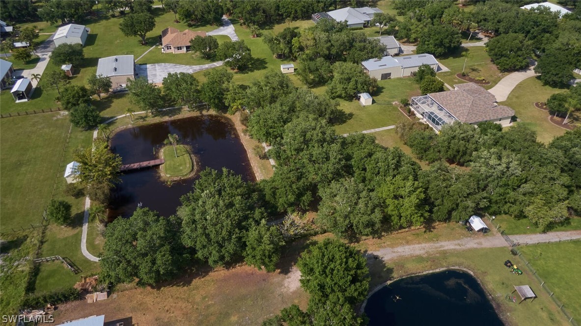 2050 Balsey Road Alva, FL 33920 - Photo 29 of 35 an aerial view of residential houses with outdoor space and trees