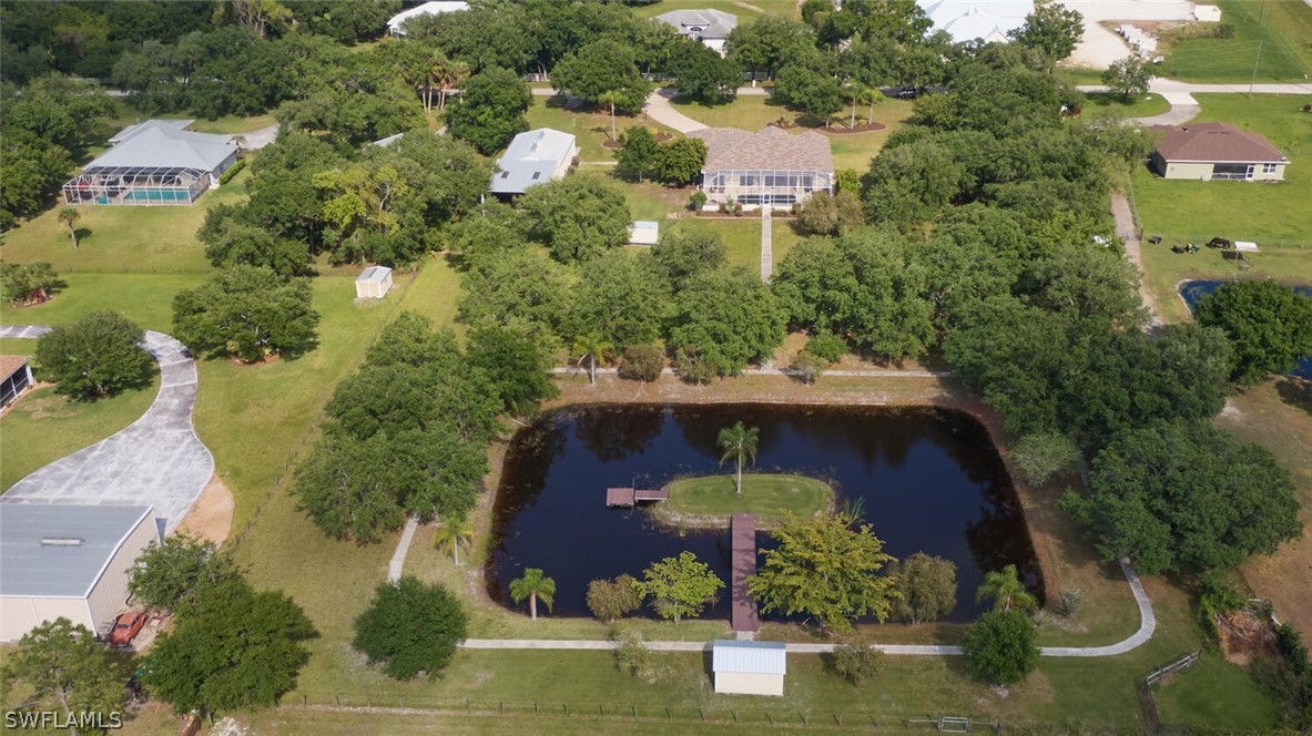 2050 Balsey Road Alva, FL 33920 - Photo 32 of 35 an aerial view of a house with yard swimming pool and outdoor seating