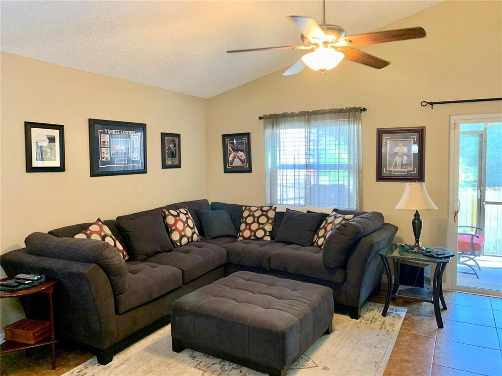 8553 Manassas Road Tampa, FL 33635 - Photo 13 of 33 a living room with furniture and a window