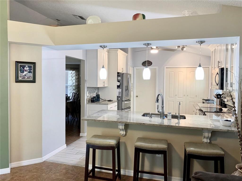 8553 Manassas Road Tampa, FL 33635 - Photo 17 of 33 a bathroom with a granite countertop sink and a mirror