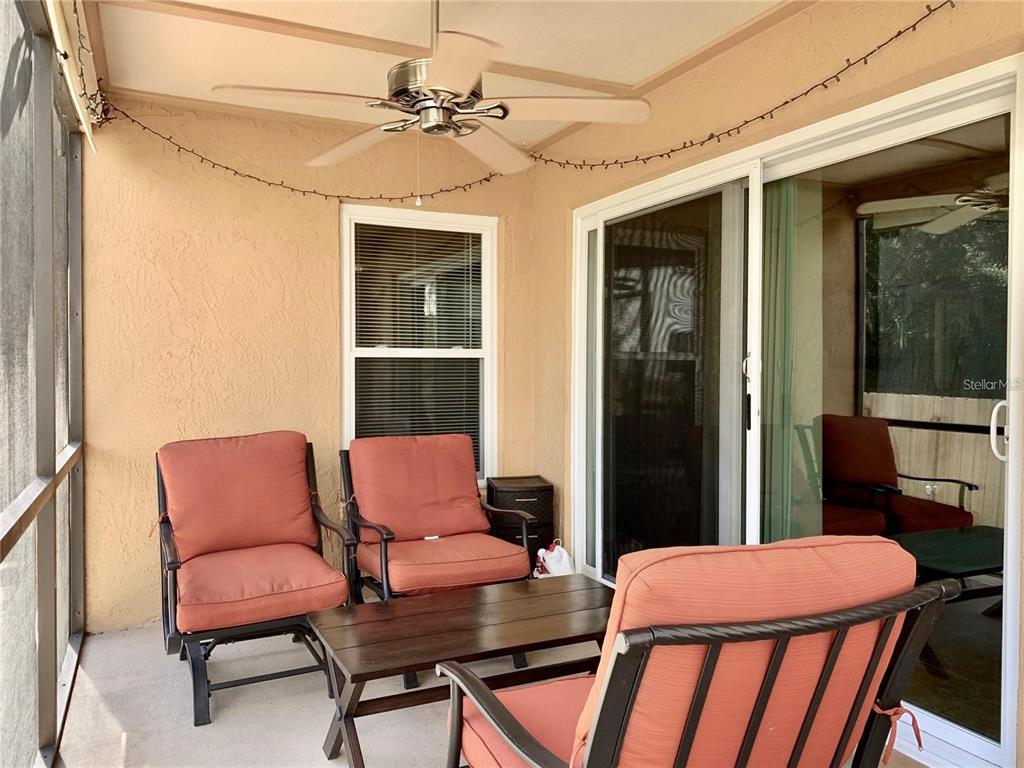 8553 Manassas Road Tampa, FL 33635 - Photo 27 of 33 a outdoor living space with furniture and a chandelier