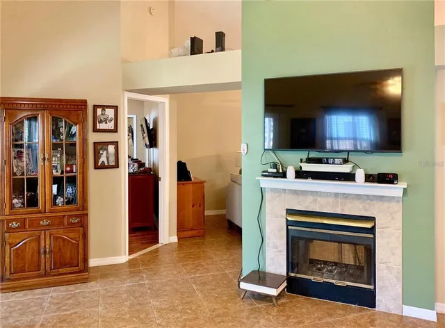 a kitchen with furniture and a fireplace