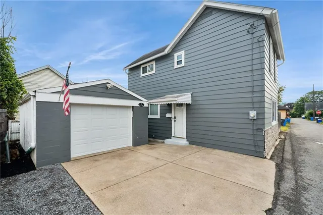 a view of a house with a garage