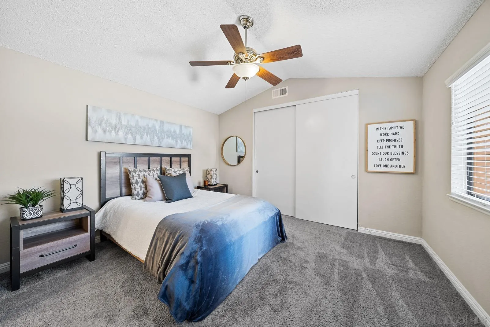 27823 Antelope Road Menifee, CA 92585 - Photo 15 of 49 a bedroom with a bed a ceiling fan and a window