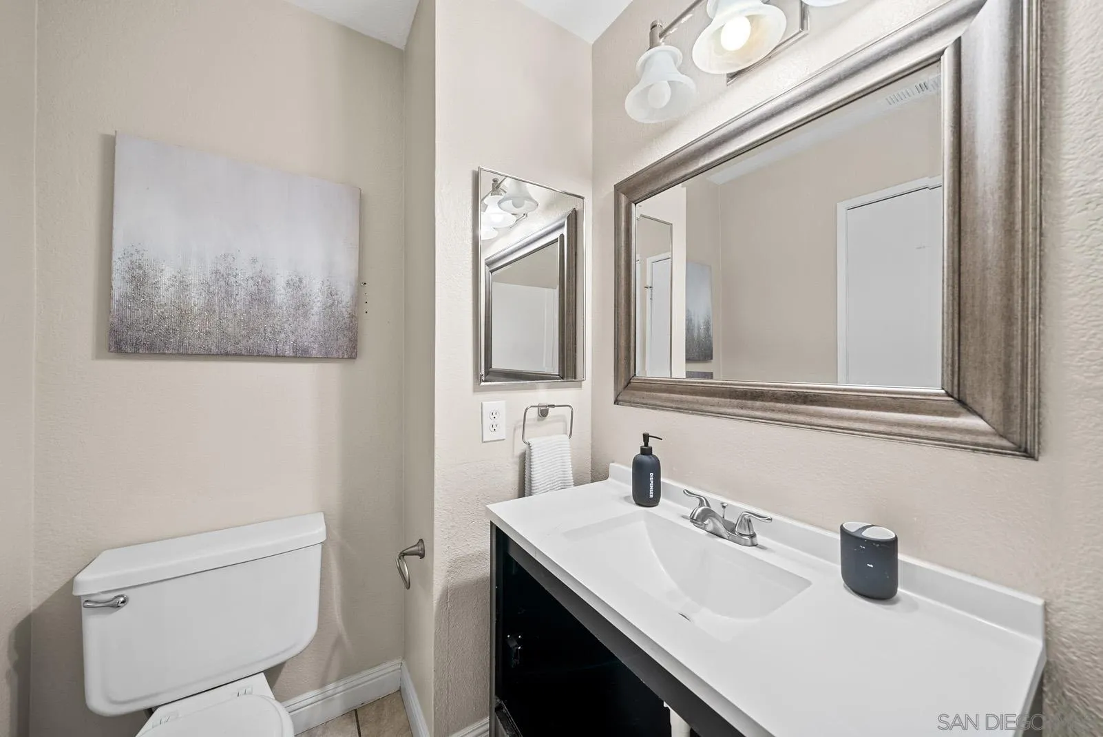 27823 Antelope Road Menifee, CA 92585 - Photo 18 of 49 a bathroom with a toilet sink and mirror