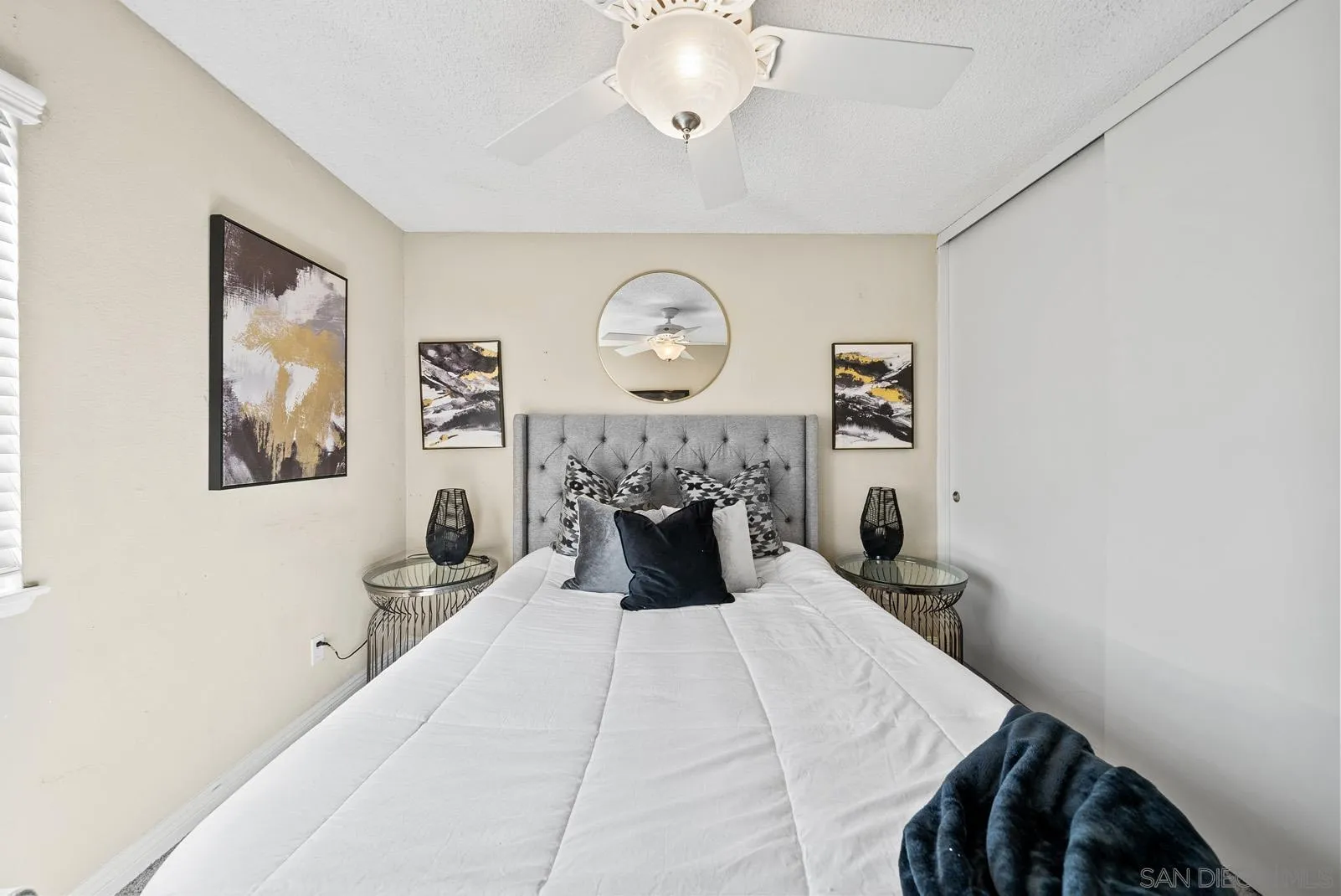 27823 Antelope Road Menifee, CA 92585 - Photo 21 of 49 a bedroom with a bed and a chandelier