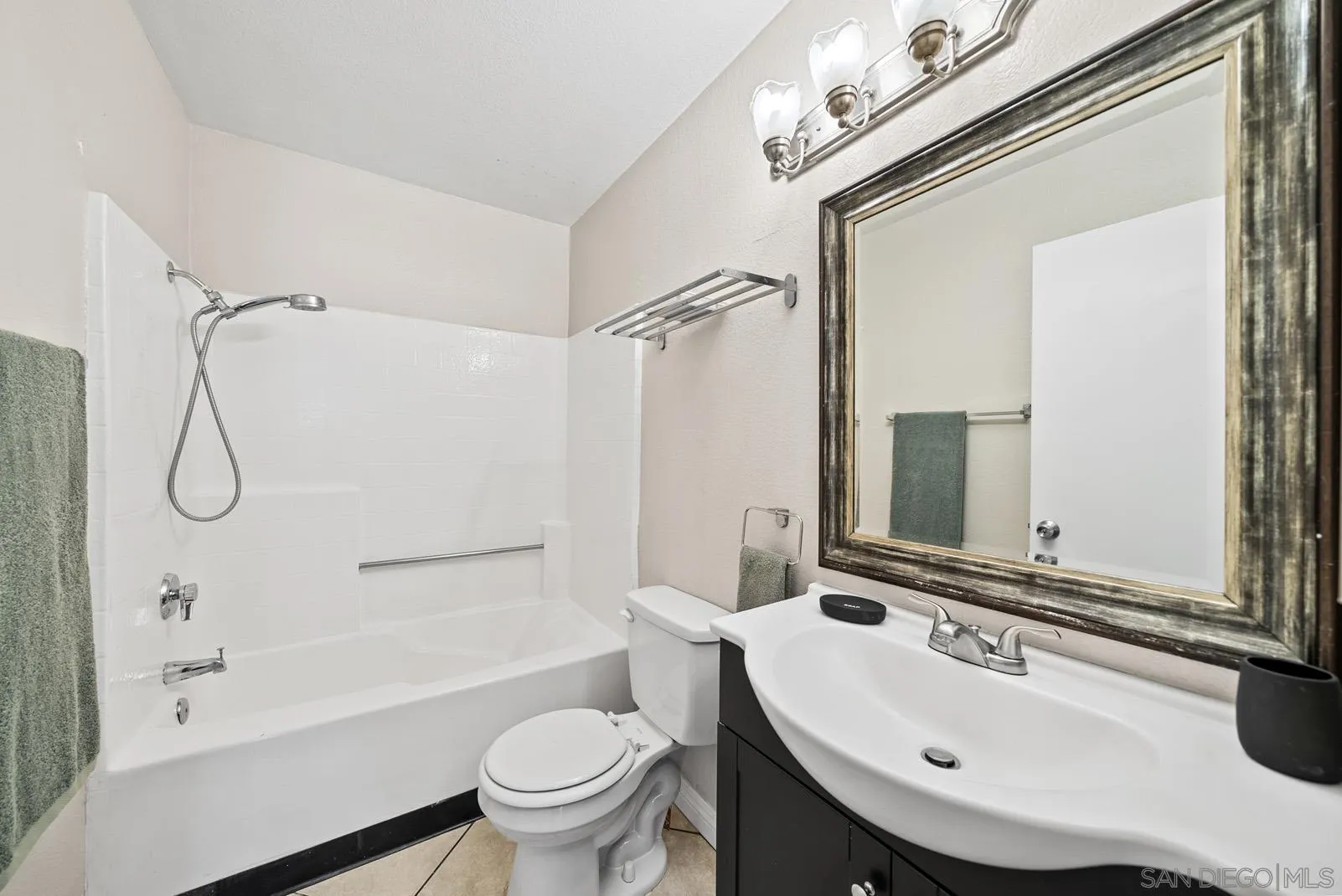 27823 Antelope Road Menifee, CA 92585 - Photo 22 of 49 a bathroom with a sink a toilet and a mirror