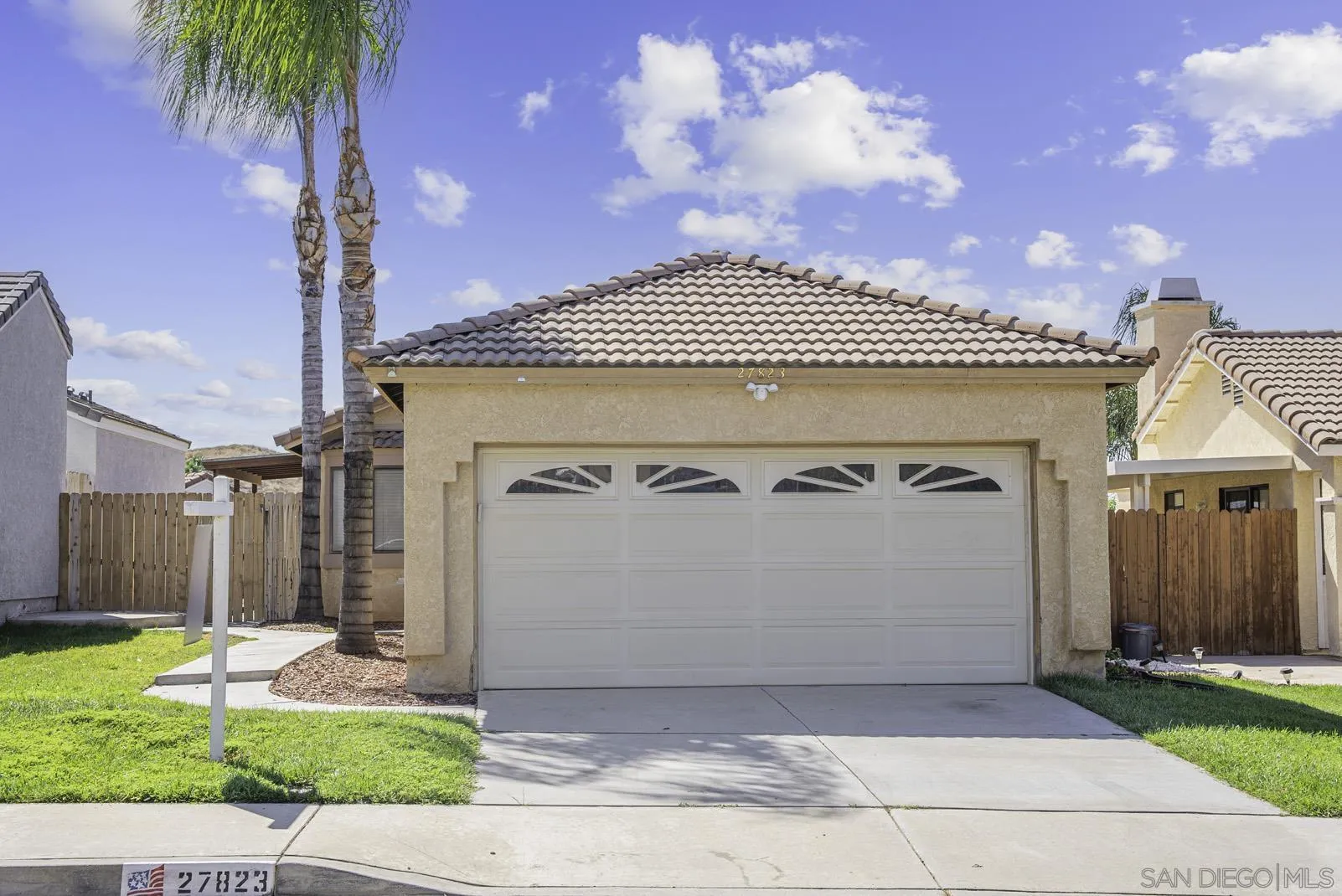 27823 Antelope Road Menifee, CA 92585 - Photo 32 of 49 a front view of a house with a garden and garage