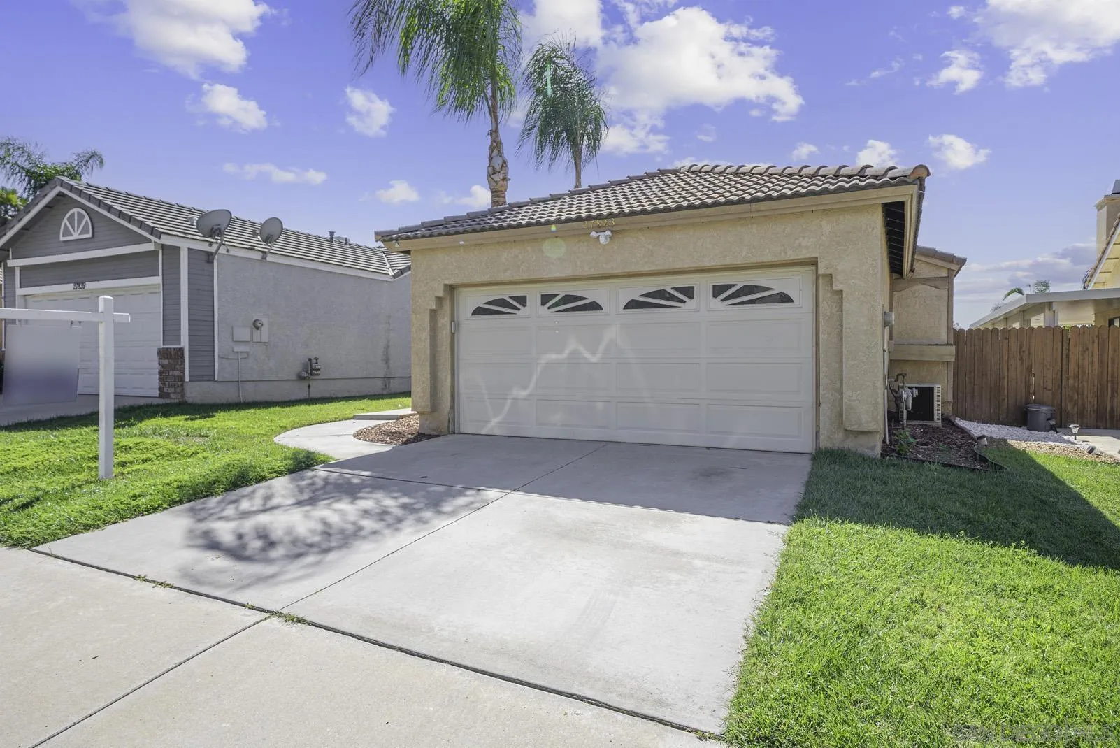 27823 Antelope Road Menifee, CA 92585 - Photo 38 of 49 a view of a house with a yard and a garage
