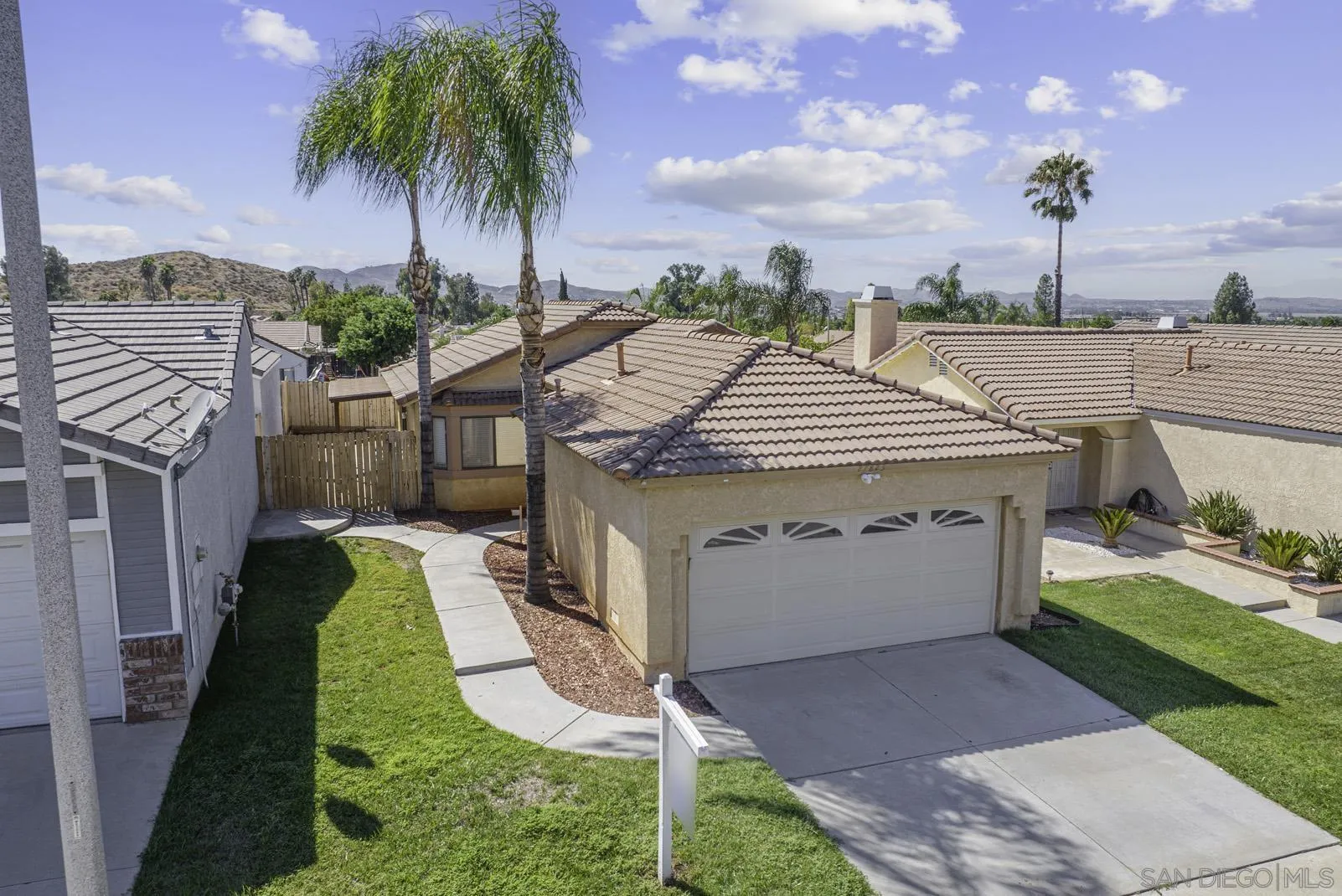 27823 Antelope Road Menifee, CA 92585 - Photo 39 of 49 a view of a house with a yard and potted plants