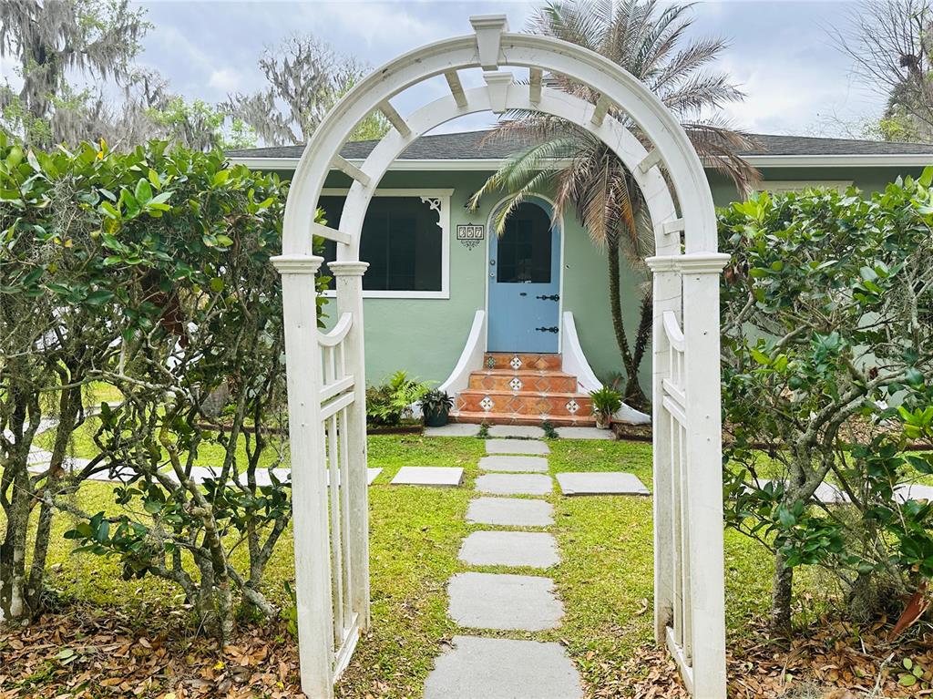357 Magnolia Place DeBary, FL 32713 - Photo 4 of 50 a front view of a house with garden