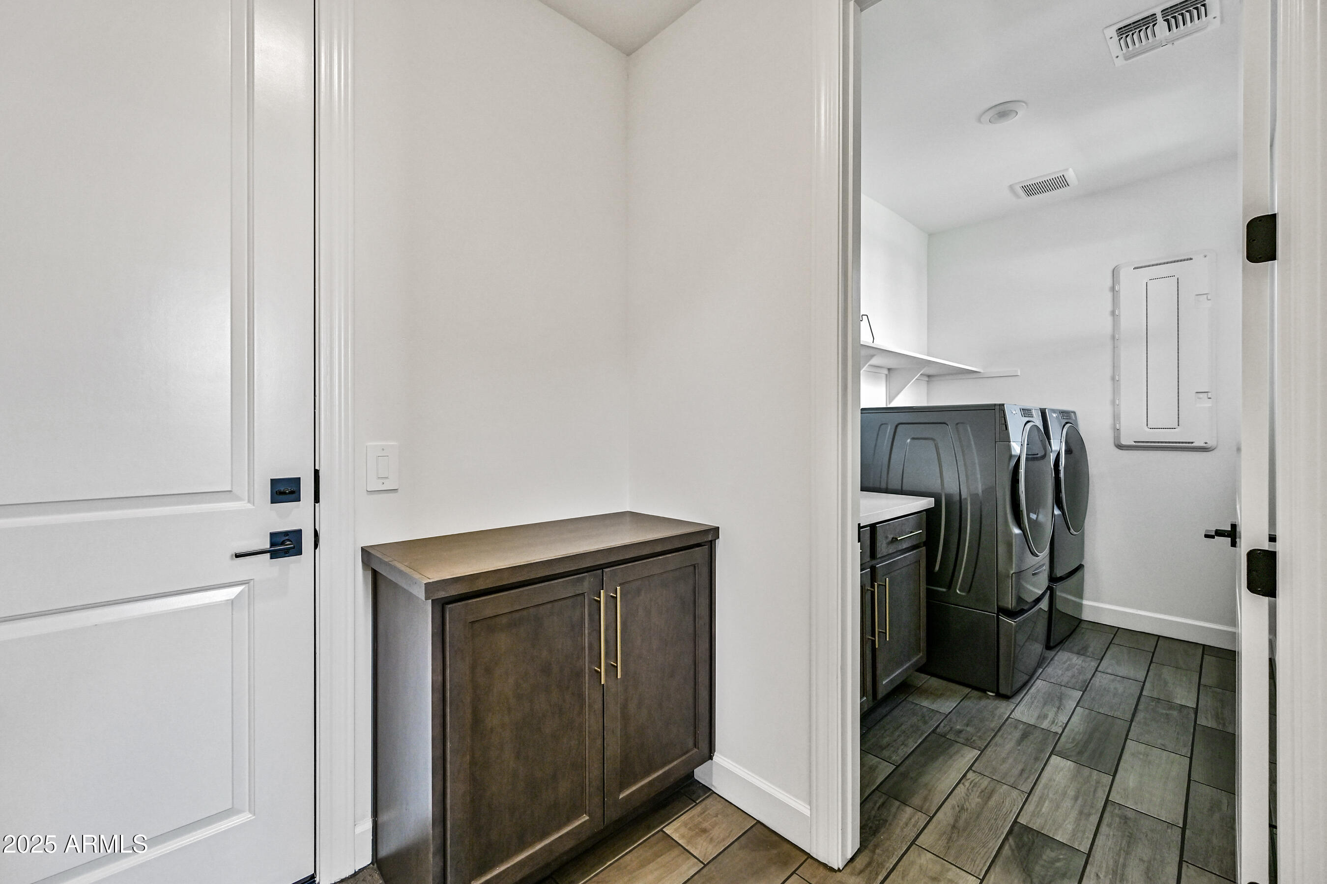 11300 North Casa Dega Drive, Unit 1061 Surprise, AZ 85388 - Photo 29 of 45 a utility room with cabinets washer and dryer