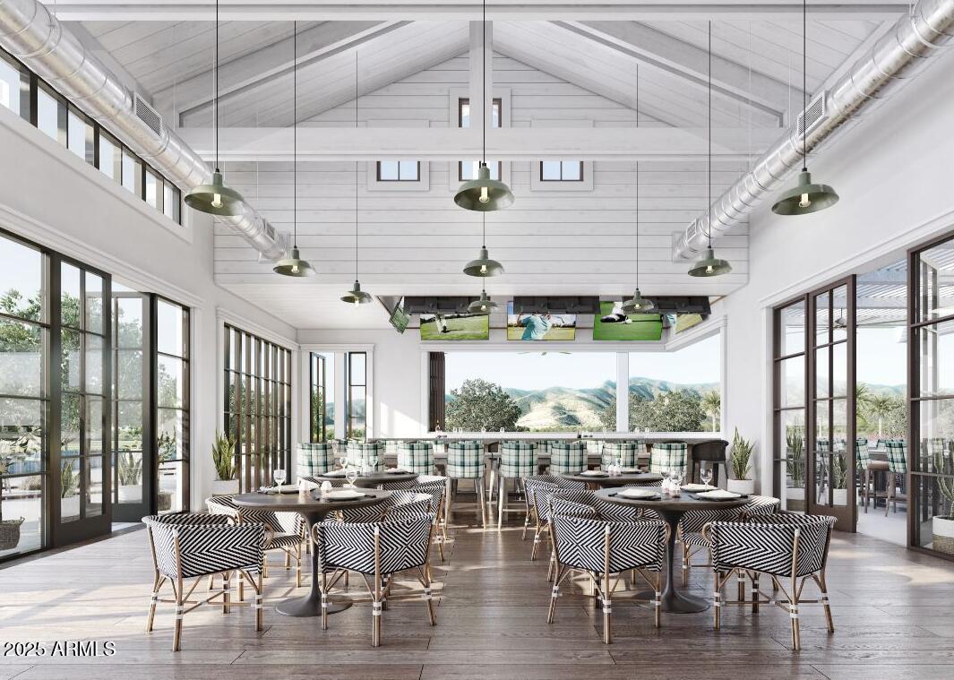 11300 North Casa Dega Drive, Unit 1061 Surprise, AZ 85388 - Photo 44 of 45 a view of a dining room with furniture wooden floor and chandelier