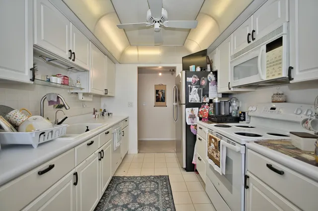 a view of a balcony with chairs
