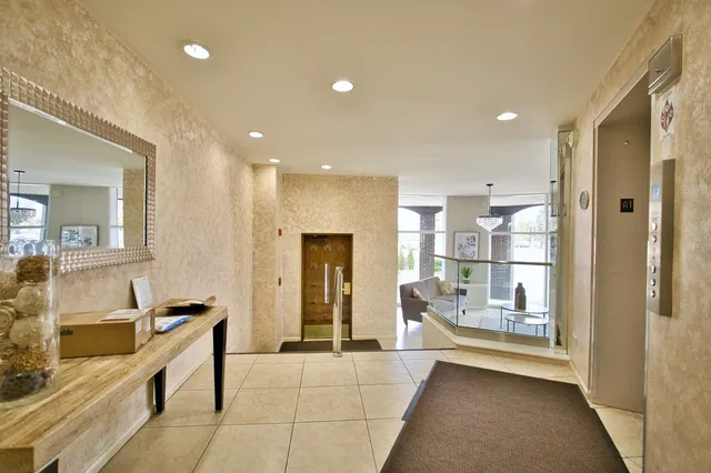 a bathroom with a tub a sink a mirror and a shower