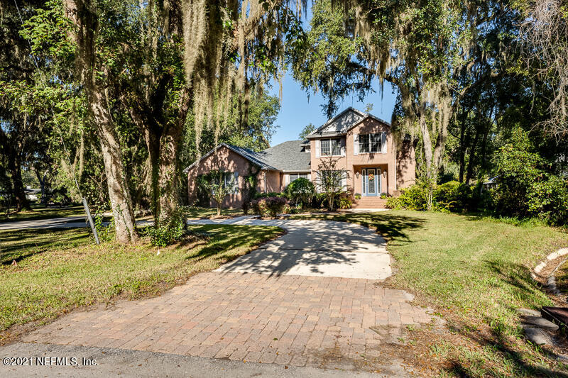 2710 Holly Point Road East Orange Park, FL 32073 - Photo 1 of 64 a front view of a house with a yard