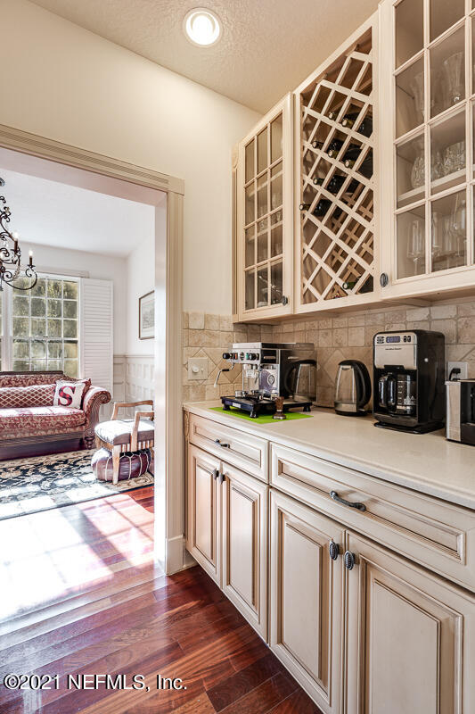 2710 Holly Point Road East Orange Park, FL 32073 - Photo 26 of 64 a kitchen with stainless steel appliances granite countertop a stove and a sink