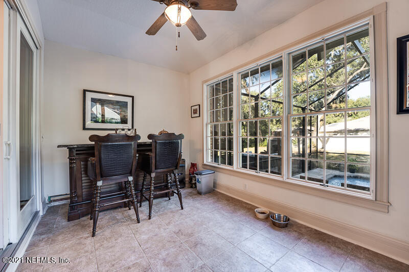 2710 Holly Point Road East Orange Park, FL 32073 - Photo 28 of 64 a view of a workspace with furniture and a window