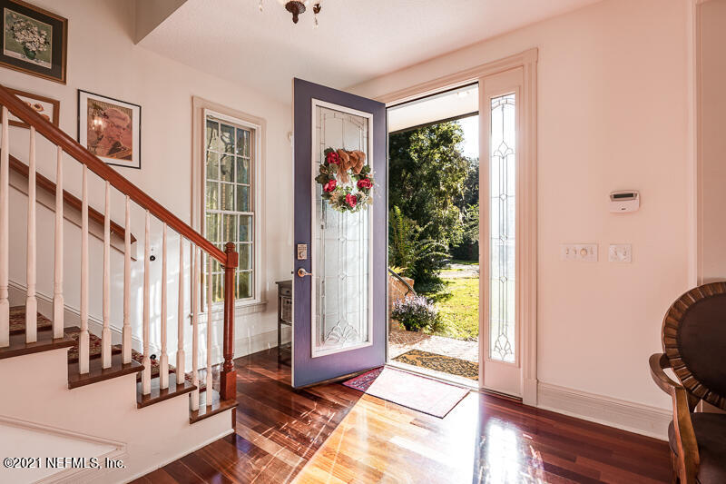 2710 Holly Point Road East Orange Park, FL 32073 - Photo 6 of 64 a view of an entryway with wooden floor and door