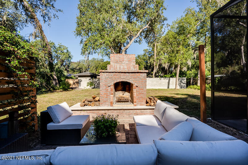 2710 Holly Point Road East Orange Park, FL 32073 - Photo 54 of 64 a view of a patio with couches table and chairs and potted plants