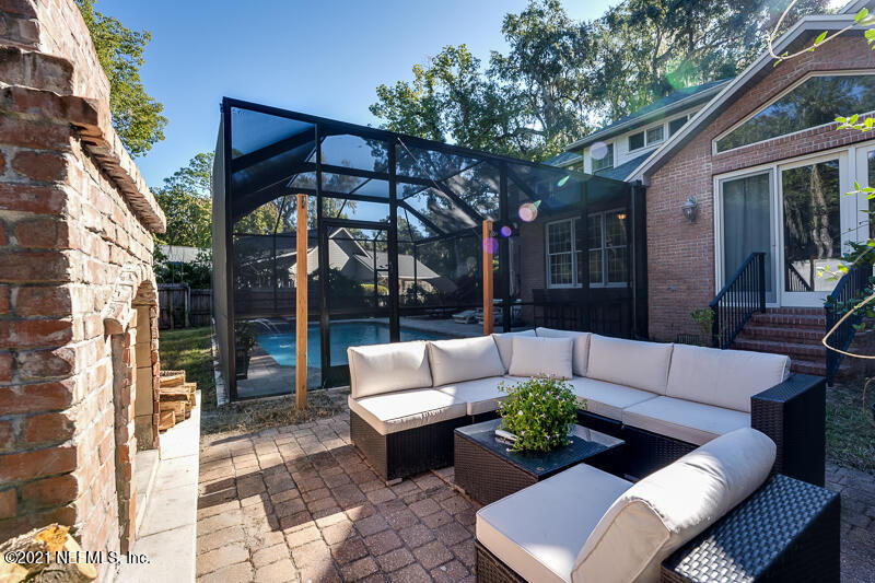 2710 Holly Point Road East Orange Park, FL 32073 - Photo 56 of 64 a view of a patio with couches and a potted plant on a table